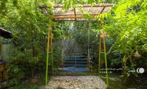 کلبه نزدیک رودخانه همراه با آلاچیق و تاب کلبه نزدیک رودخانه همراه با آلاچیق و تاب