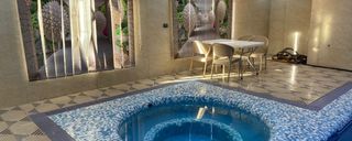 استخرآبگرم سرپوشیده وجکوزی،آلاچیق و آتشکده در حیاط استخرآبگرم سرپوشیده وجکوزی،آلاچیق و آتشکده در حیاط